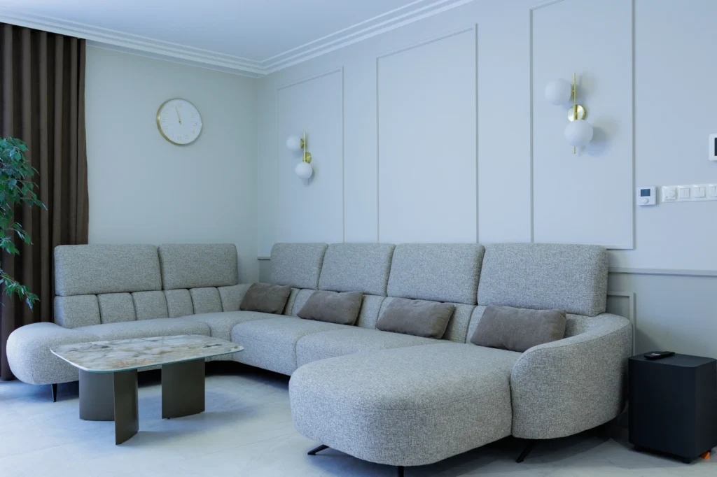 tonowany salon z szarą narożną sofą — Mieszkanie